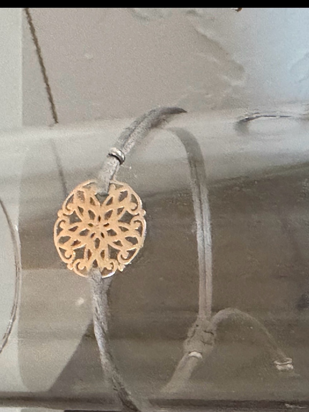 Delicate Gray Cord Bracelet with Filigree Gold Medallion